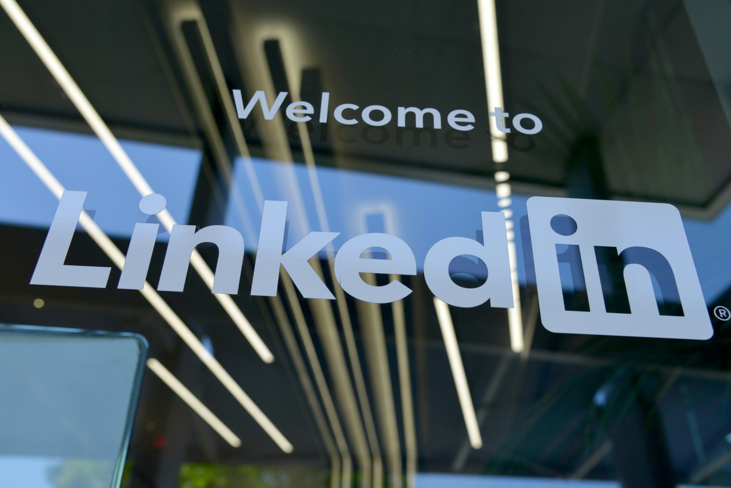 LinkedIn logo on a glass door